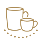 Large glasses, mugs and teapots on the breakfast table